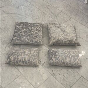 Set of Four Gray Patterned Throw Pillows